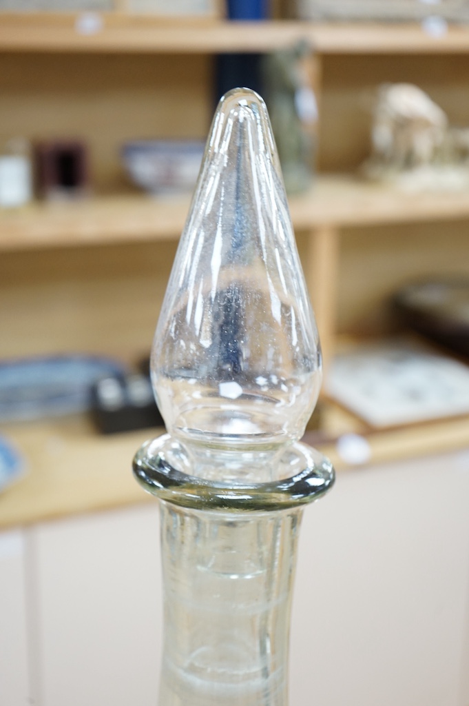 A pair of clear glass chemist's carboys and stoppers, 81cm high including stoppers. Condition - good